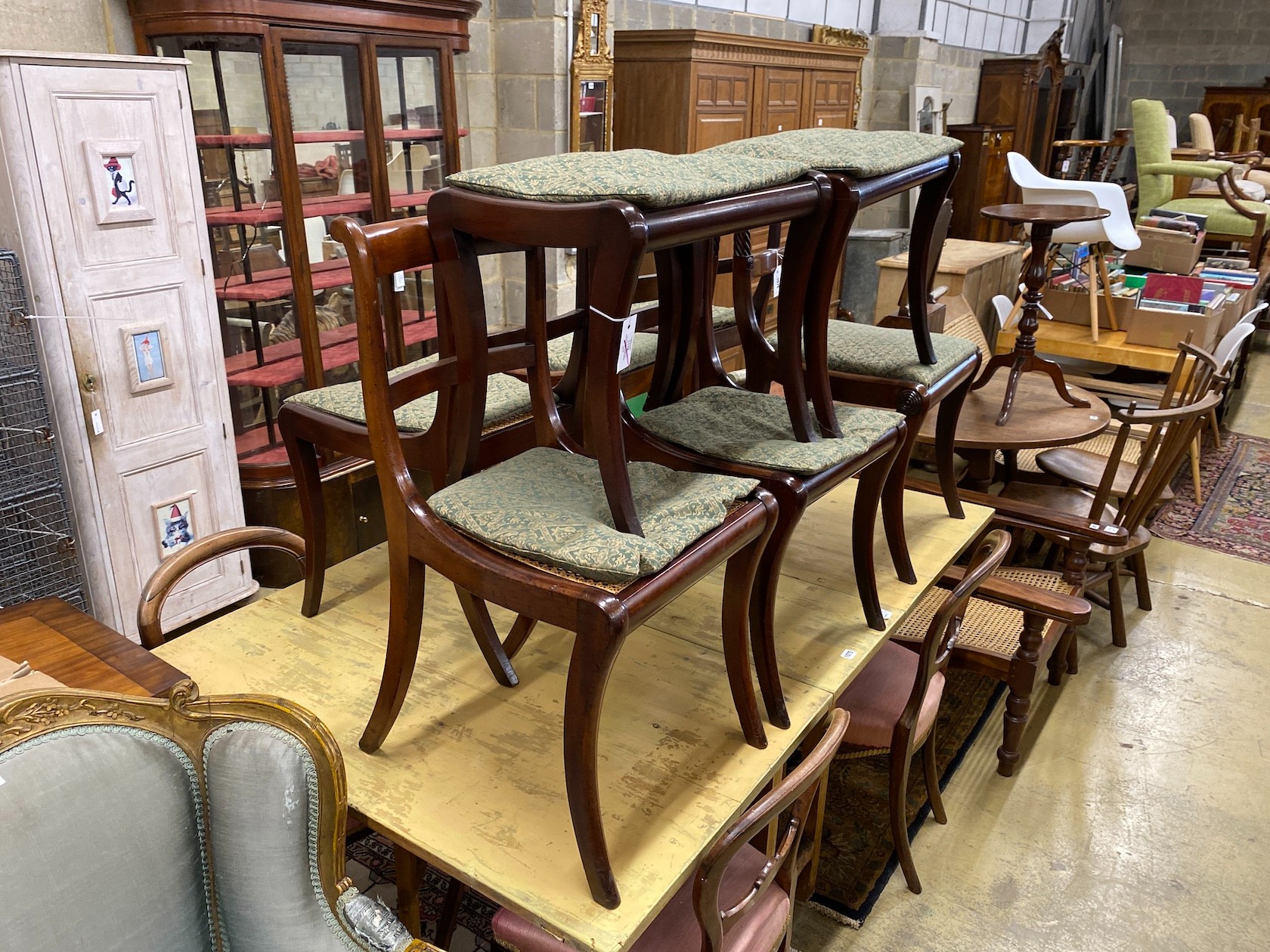 Six Regency mahogany cane and drop in seat dining chairs (four plus two)